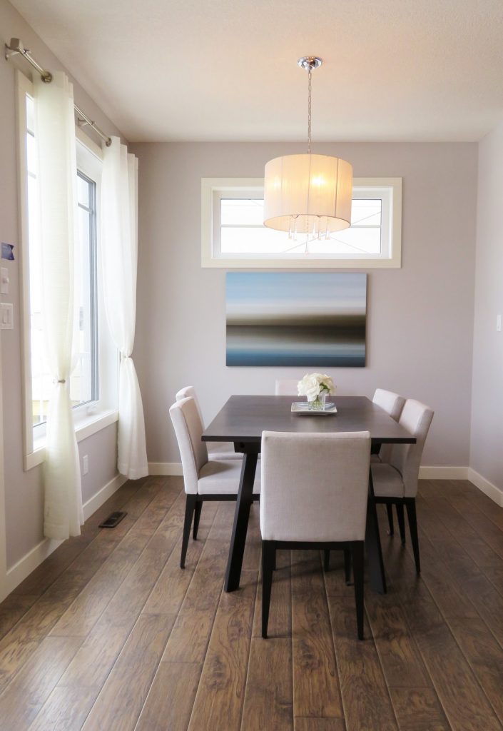 Minimalist, clean and contemporary dining room with wooden floors